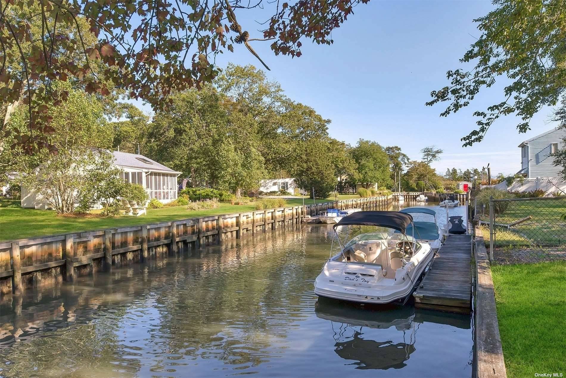 Located on a canal, recently renovated with updates to kitchen amp ; Baths, spacious open floor plan.