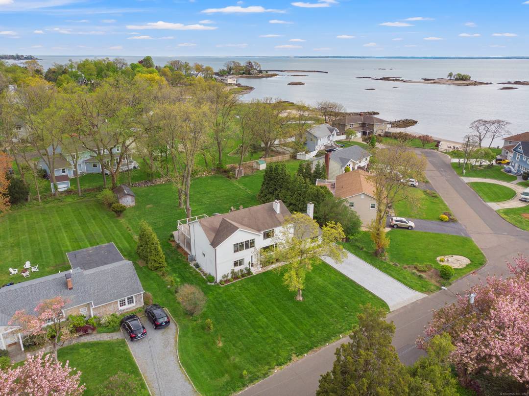 Spend your best summer yet in this stunning 5 bedroom retreat just steps from a private deeded beach, shared with only 12 homes, at the end of a peaceful cul ...