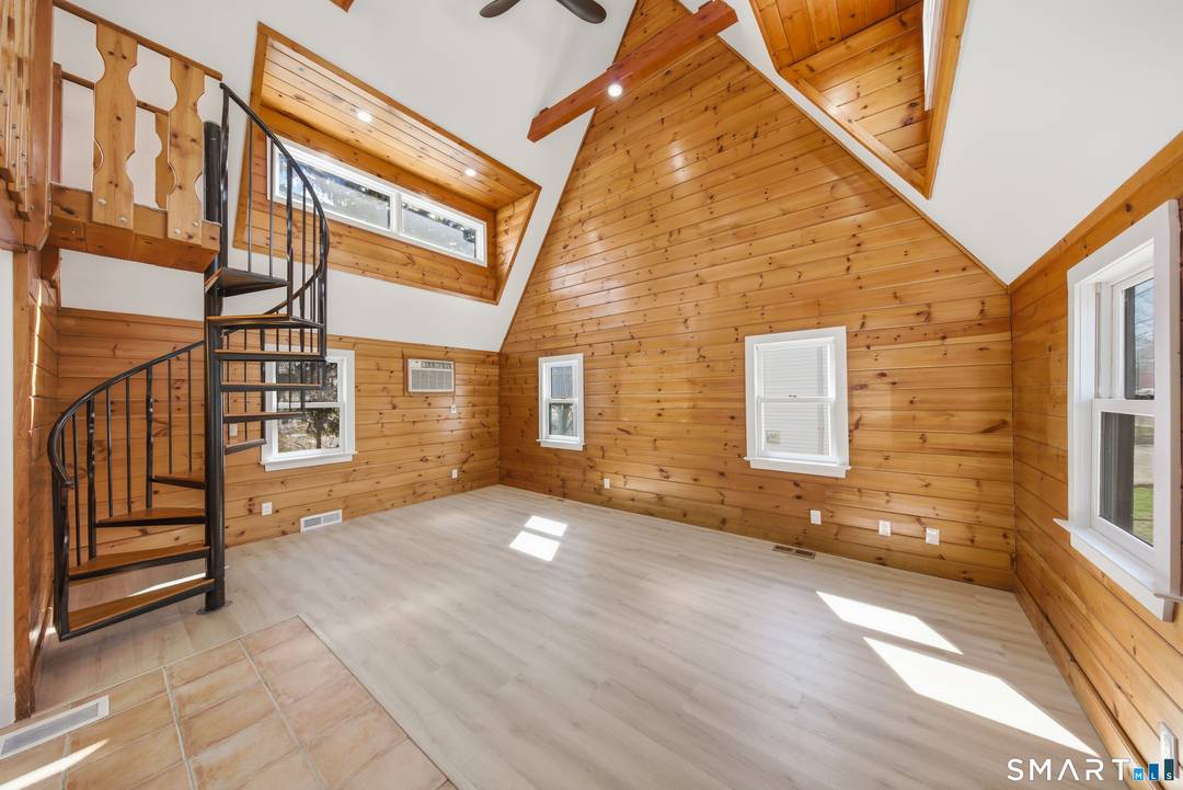 Tucked in Norwalk's Broad River neighborhood, this distinctive single family home offers the charm of a ski chalet with the convenience of an in town location.