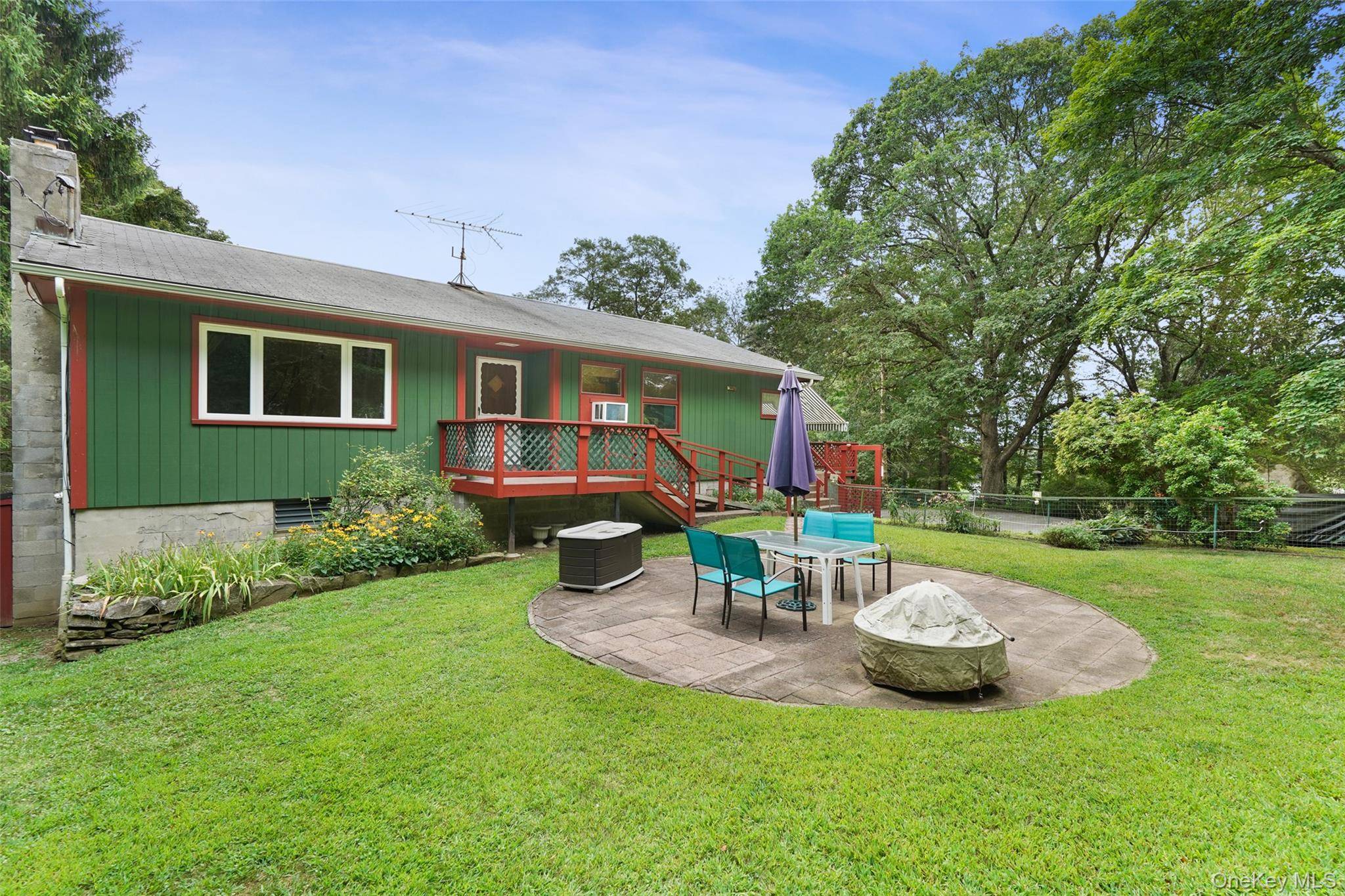 Step right into this charming 3 bedroom ranch nestled on over 2 acres of beautifully landscaped grounds, adorned with perennial shrubs and vibrant flowers, your own private oasis !