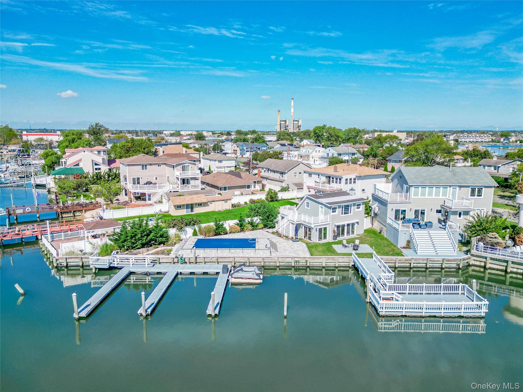 Welcome to this rare and extraordinary waterfront estate the largest open bayfront property on the coveted Barnum Island in Island Park.
