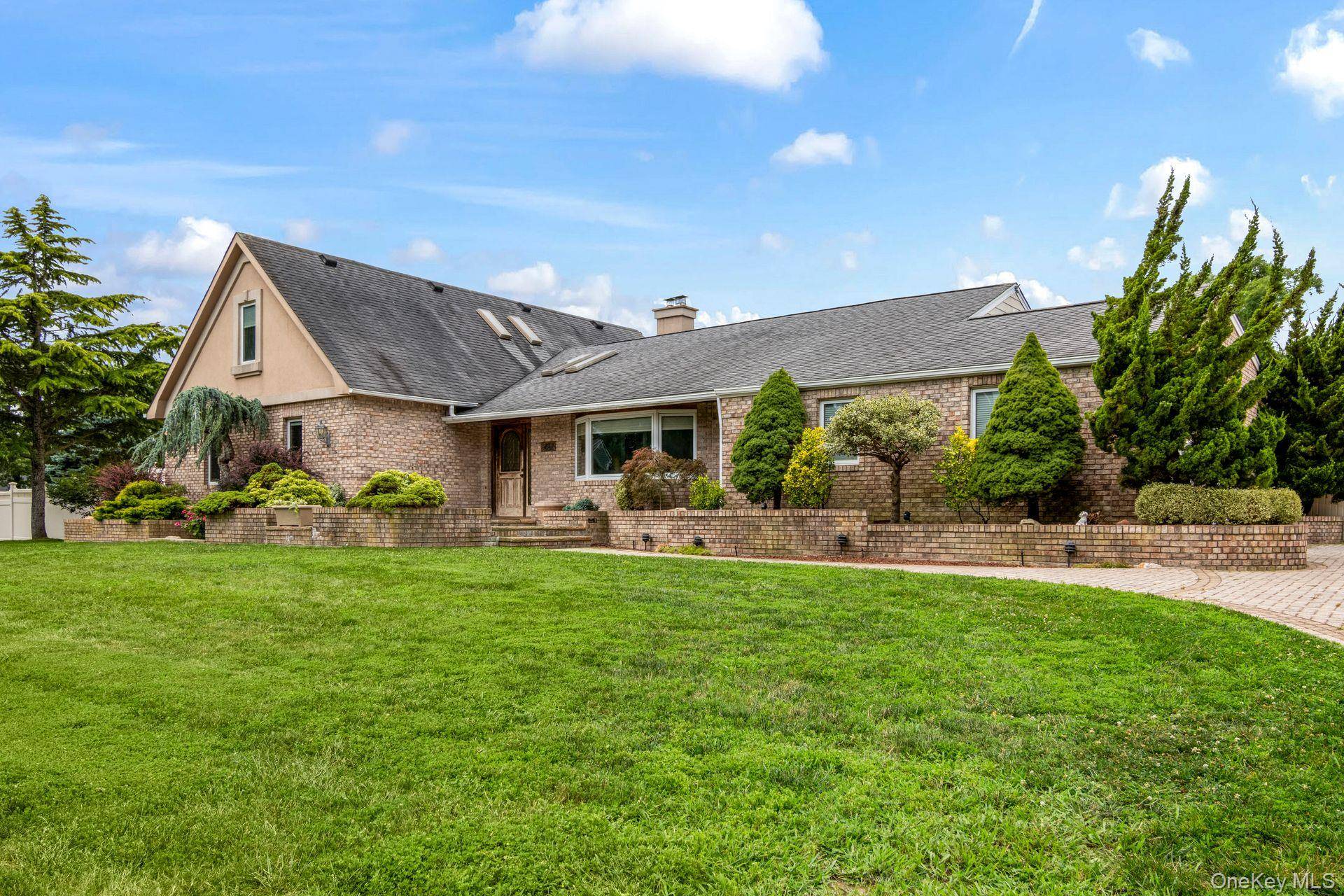 Set on nearly an acre of manicured, park like grounds, this sprawling 5 bedroom, 3 bath farm ranch in desirable Great River offers the perfect mix of space, privacy, and ...
