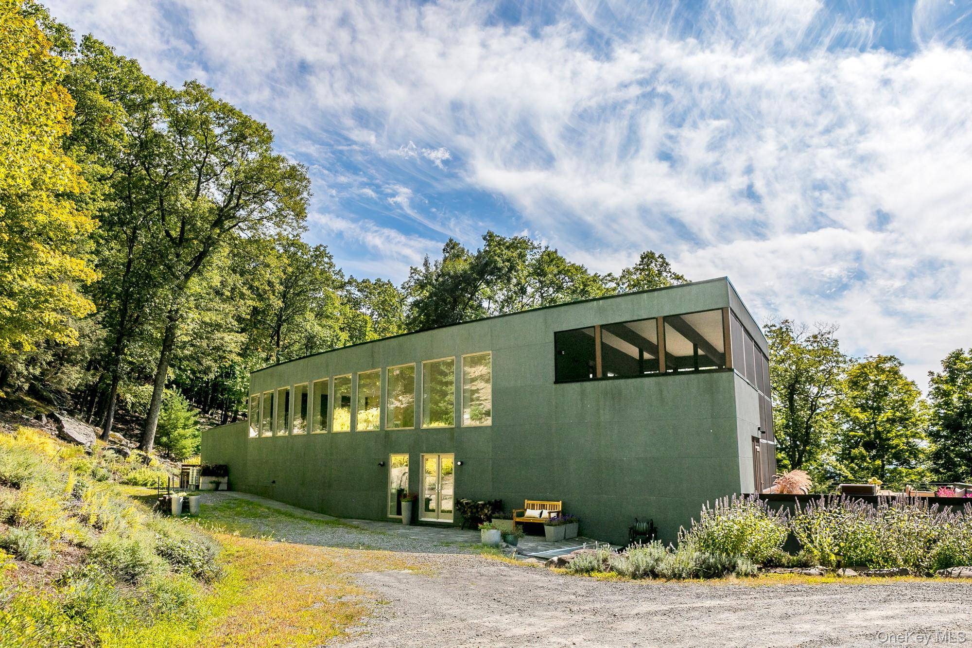 Swoop House is a residence with two great rooms, one of which was designed as a professional art studio.