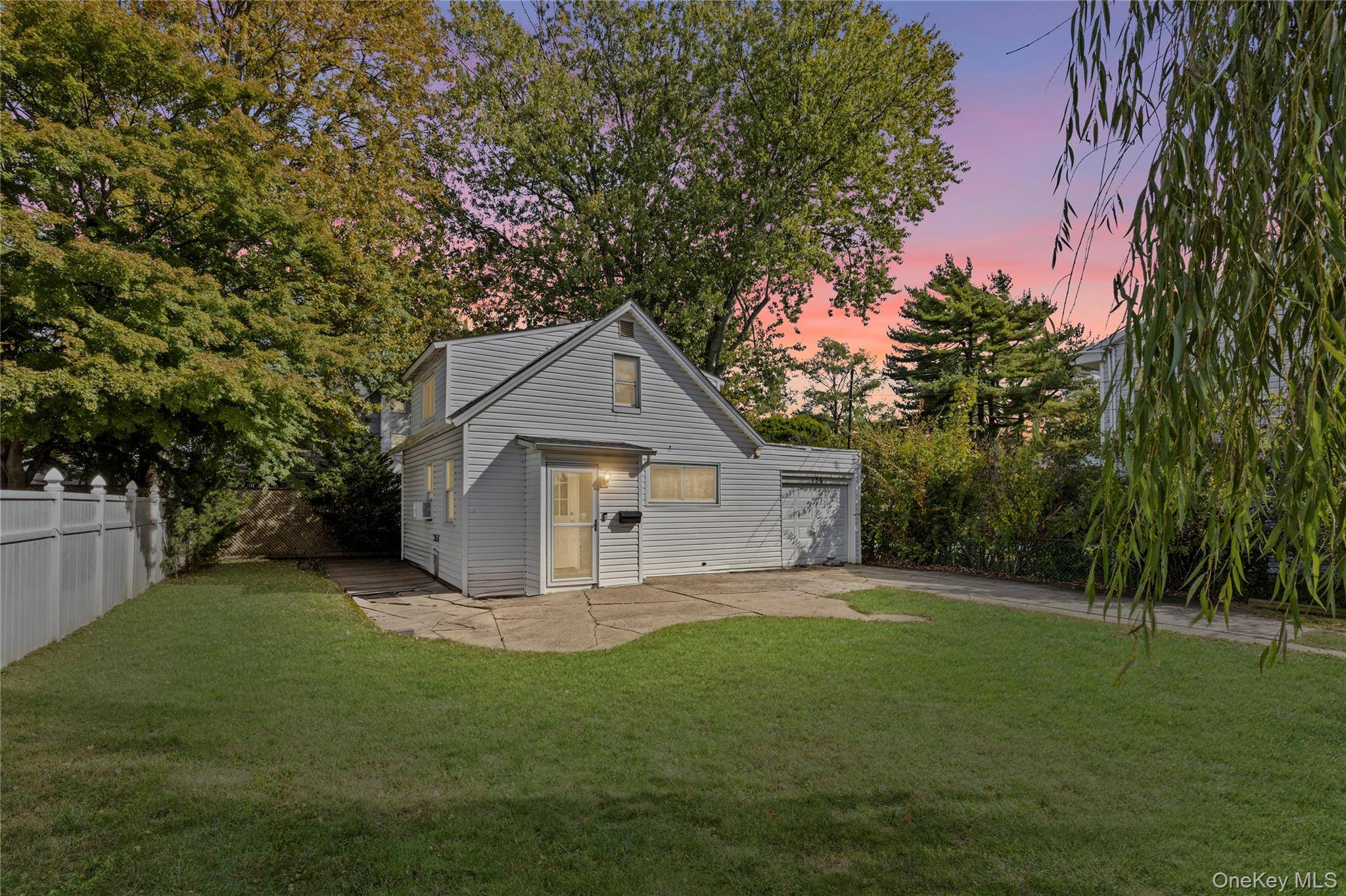 Welcome home to this charming cape style house located in the heart of Lindenhurst Village.