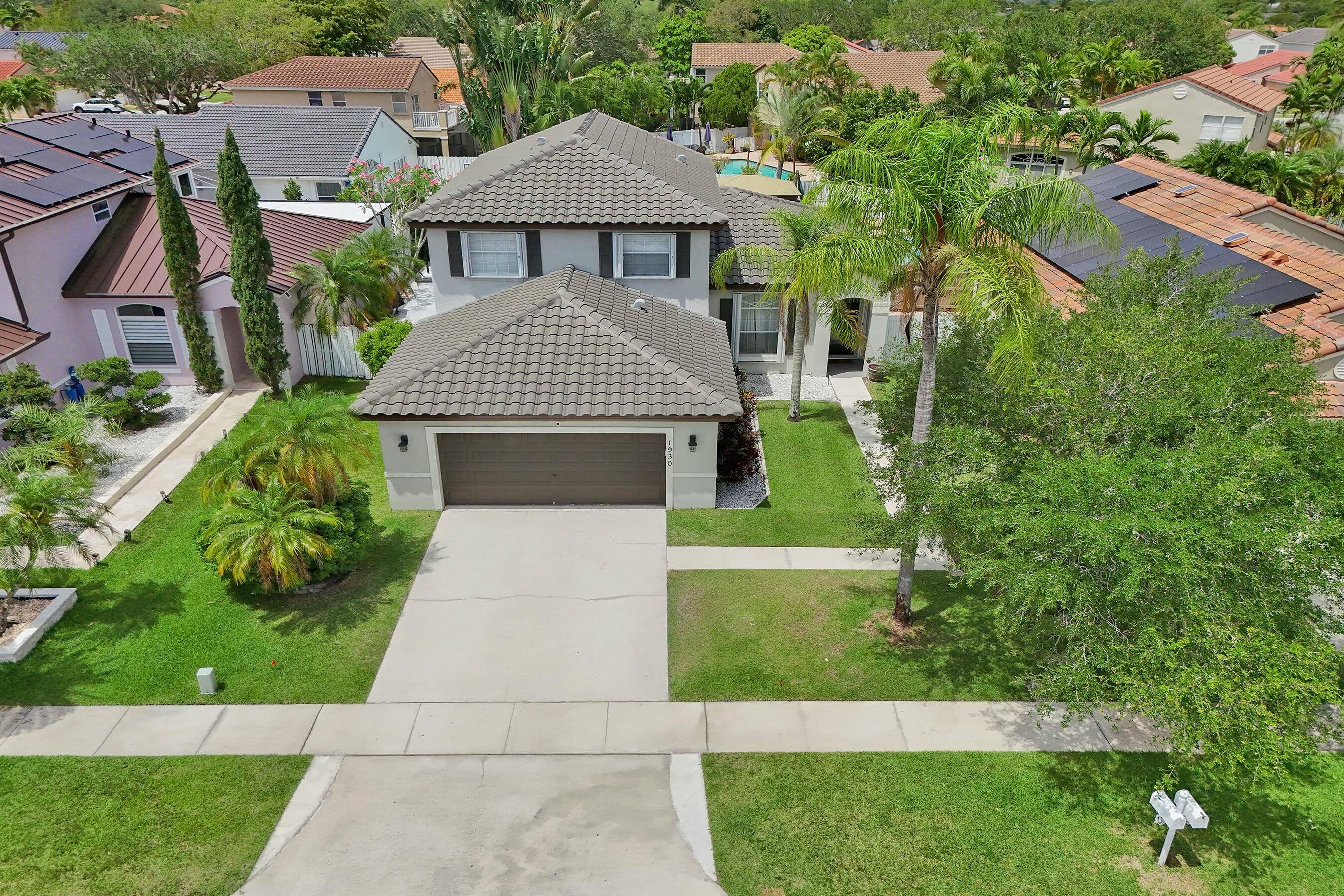 Beautiful 4 bedroom 3 bath home with pool, 2 car garage open concept layout with soaring volume ceilings !