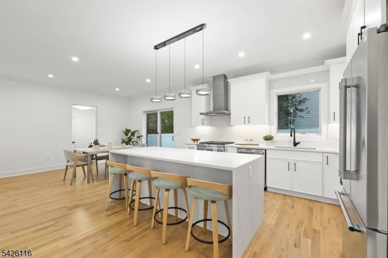 Expertly designed by architect Tim Klesse, this stunning 2025 new construction offers sophisticated living space across four finished levels in the heart of Millburn.