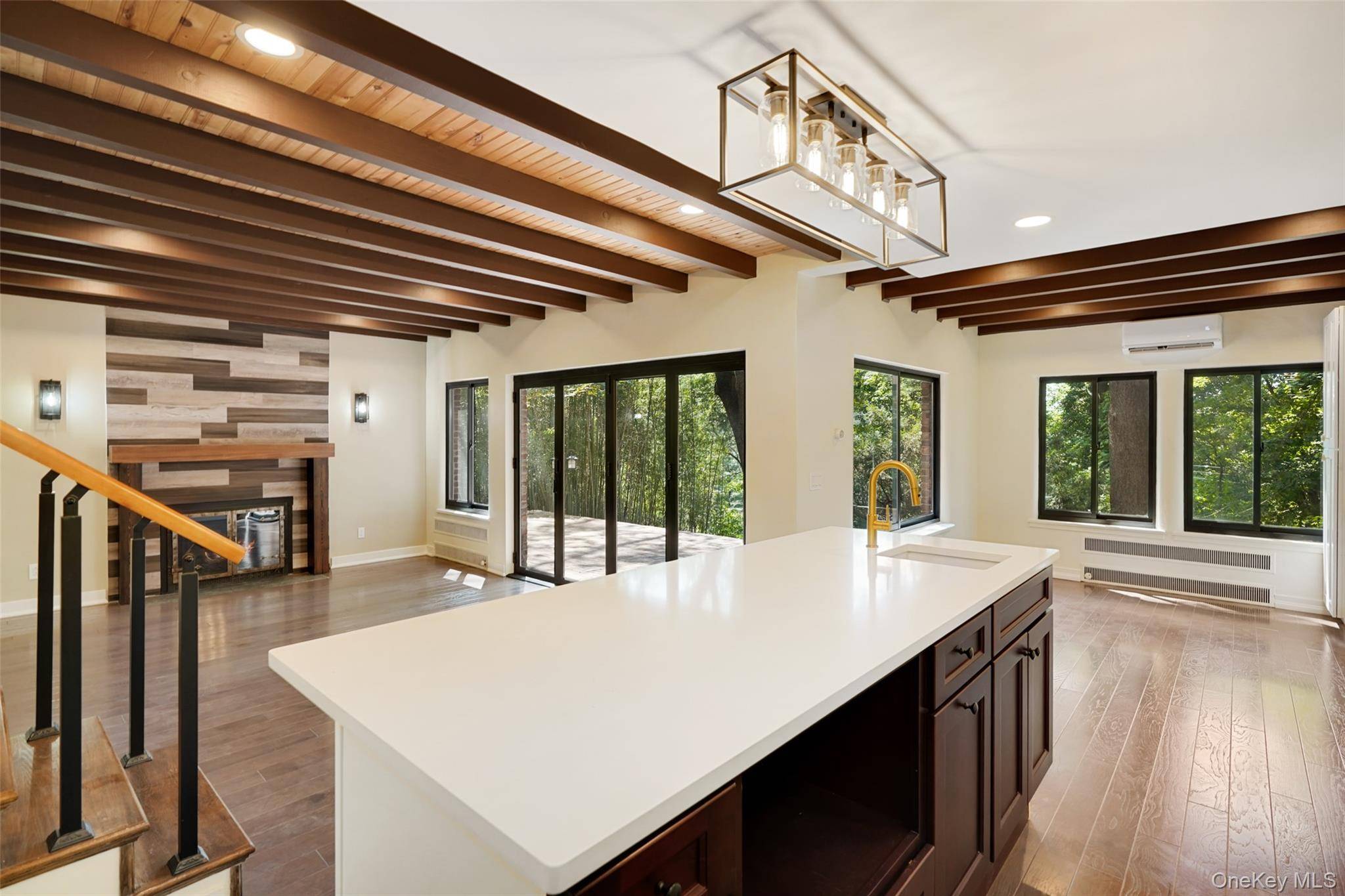 Presenting a complete interior and exterior renovation in design and construction showcasing contemporary bathrooms and an eat in kitchen with open concept living spaces !