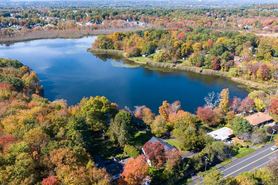 Discover an extraordinary private waterfront retreat on the historic 1860 Reservoir in Wethersfield.