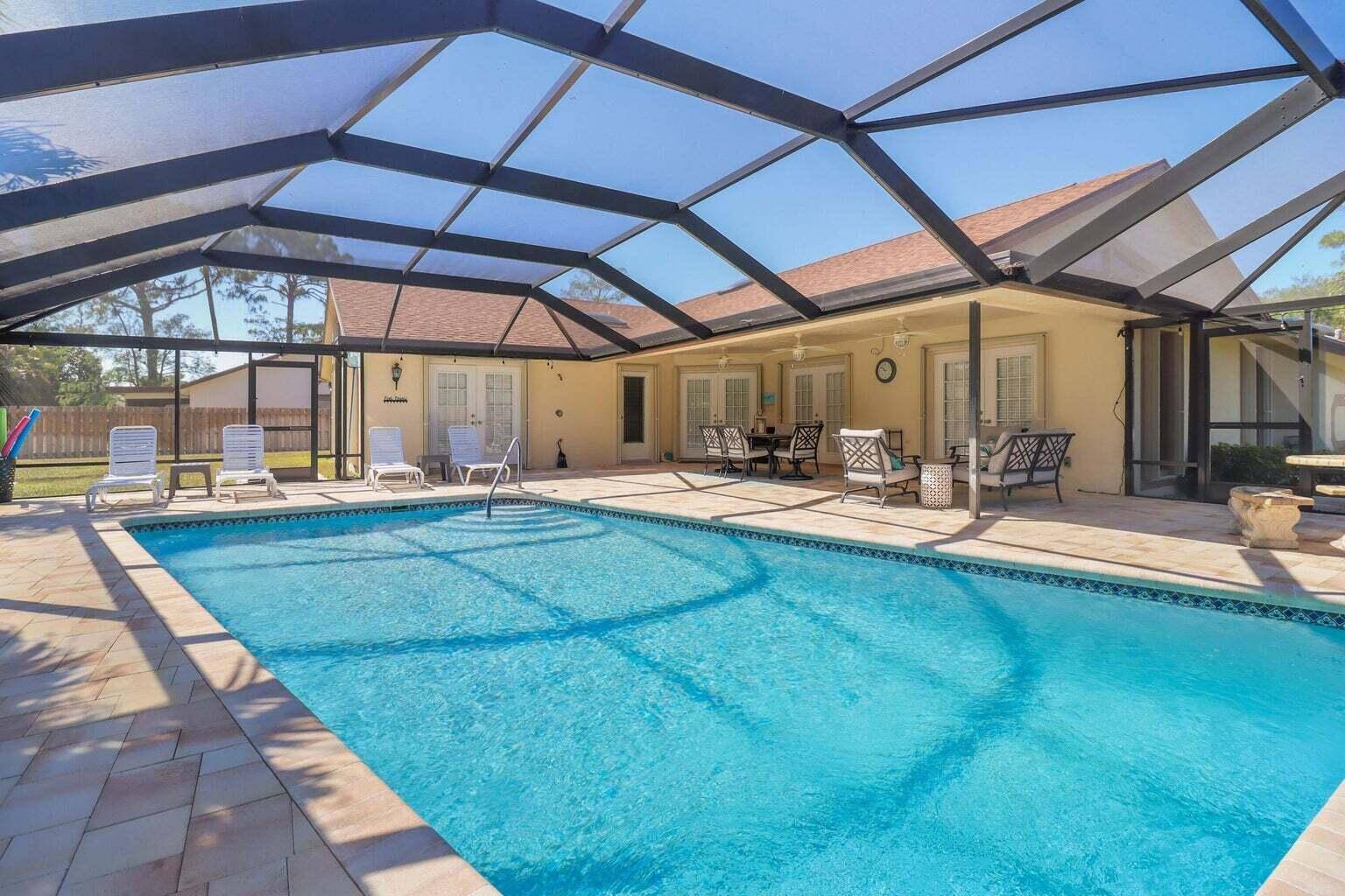 Enjoy this spacious ranch house on a corner lot with a completely fence in backyard space.