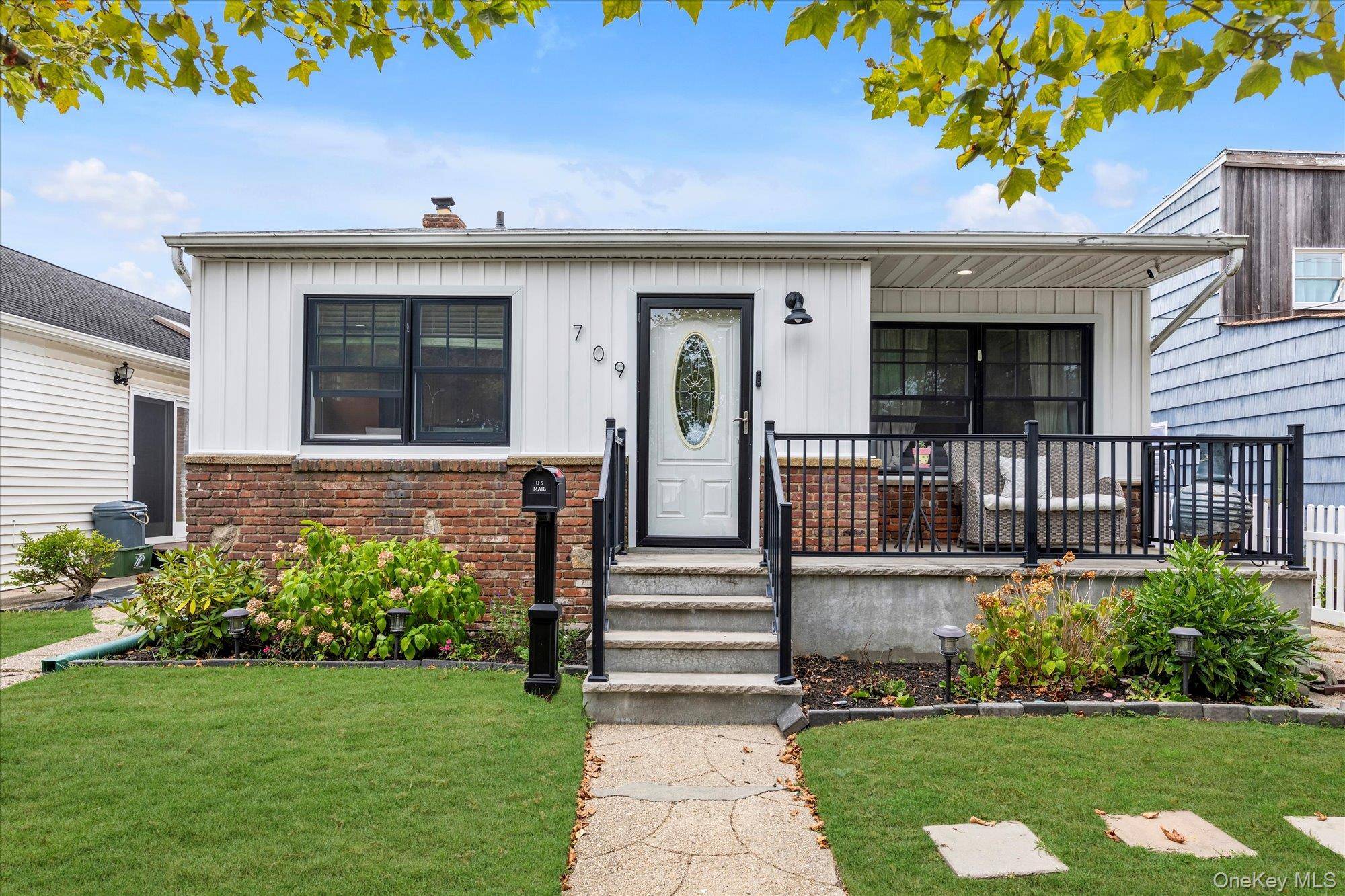 Welcome home to this beautifully updated split level with a bright and open layout !