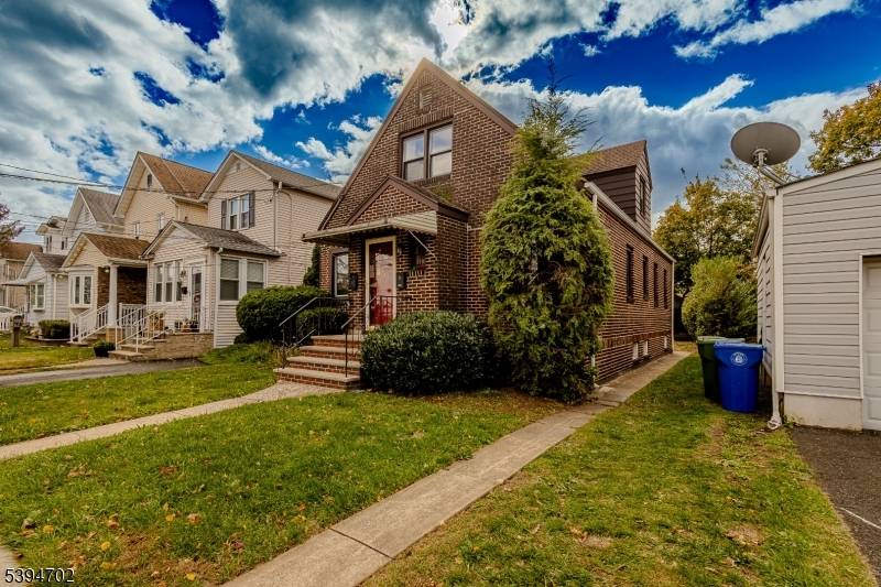 Welcome to this beautifully renovated brick two family home, perfectly situated on a serene dead end street.