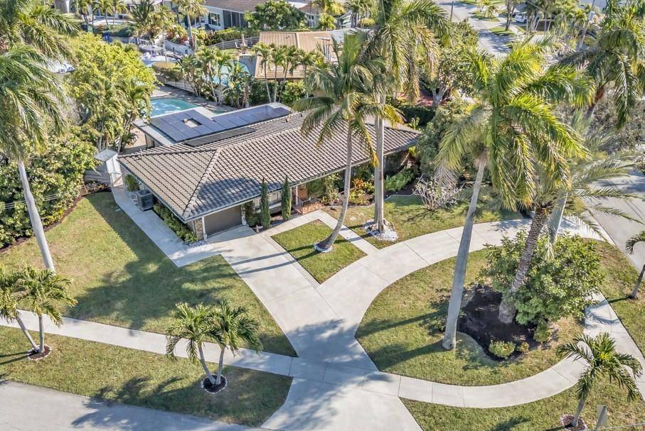 RARE OPPORTUNITY Renovated waterfront pool home on a massive corner lot in the heart of Lighthouse Point with no fixed bridges and direct DEEP WATER, ocean access.