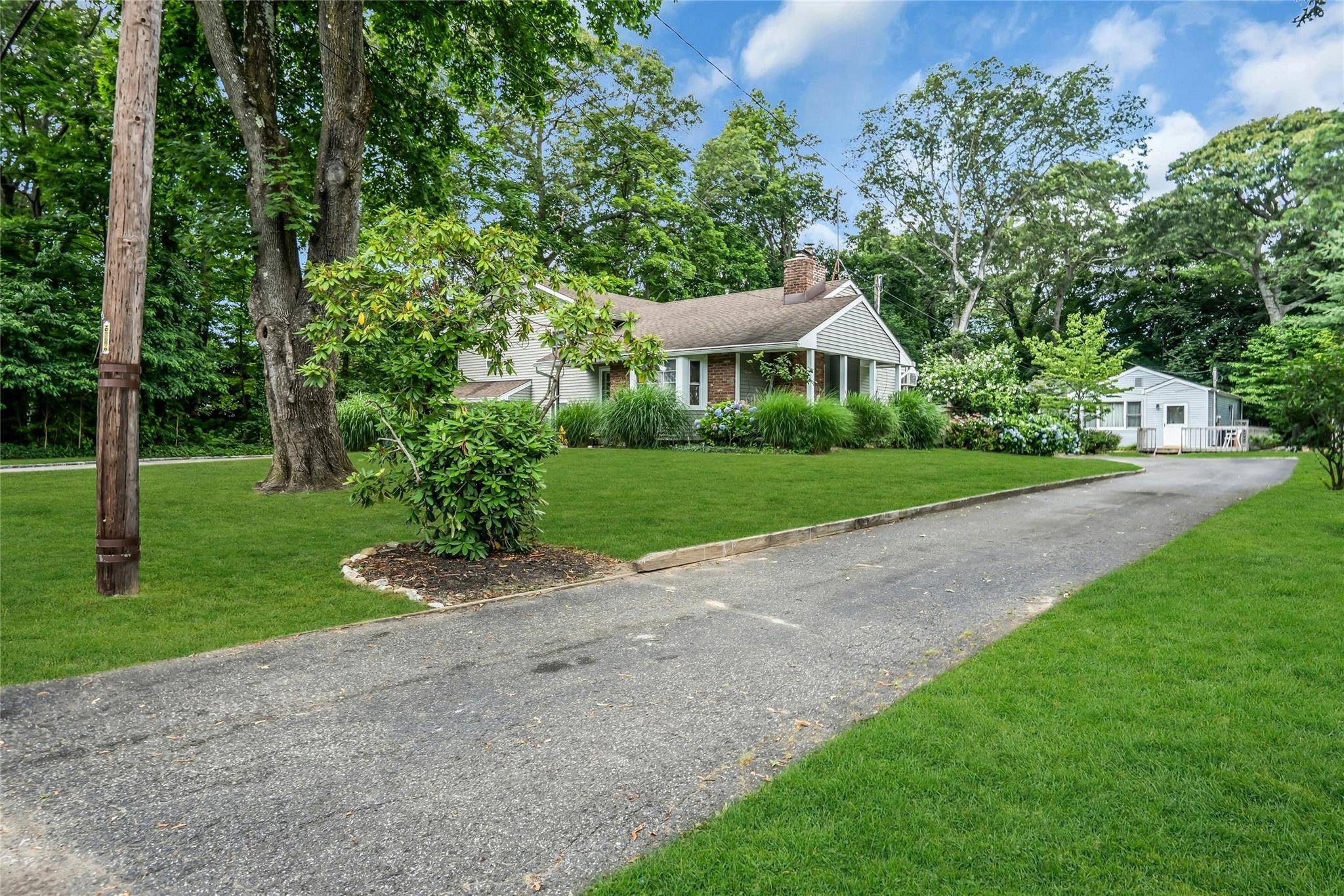 This unique property offers not one, but two separate dwellings on a beautifully half acre landscaped lot.