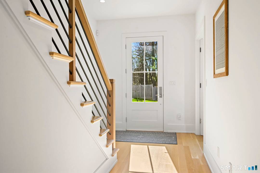 Discover refined, better than new construction at 9 White Barns Lane, ideally located in the desirable White Barns community within Norwalk's sought after Cranbury neighborhood.