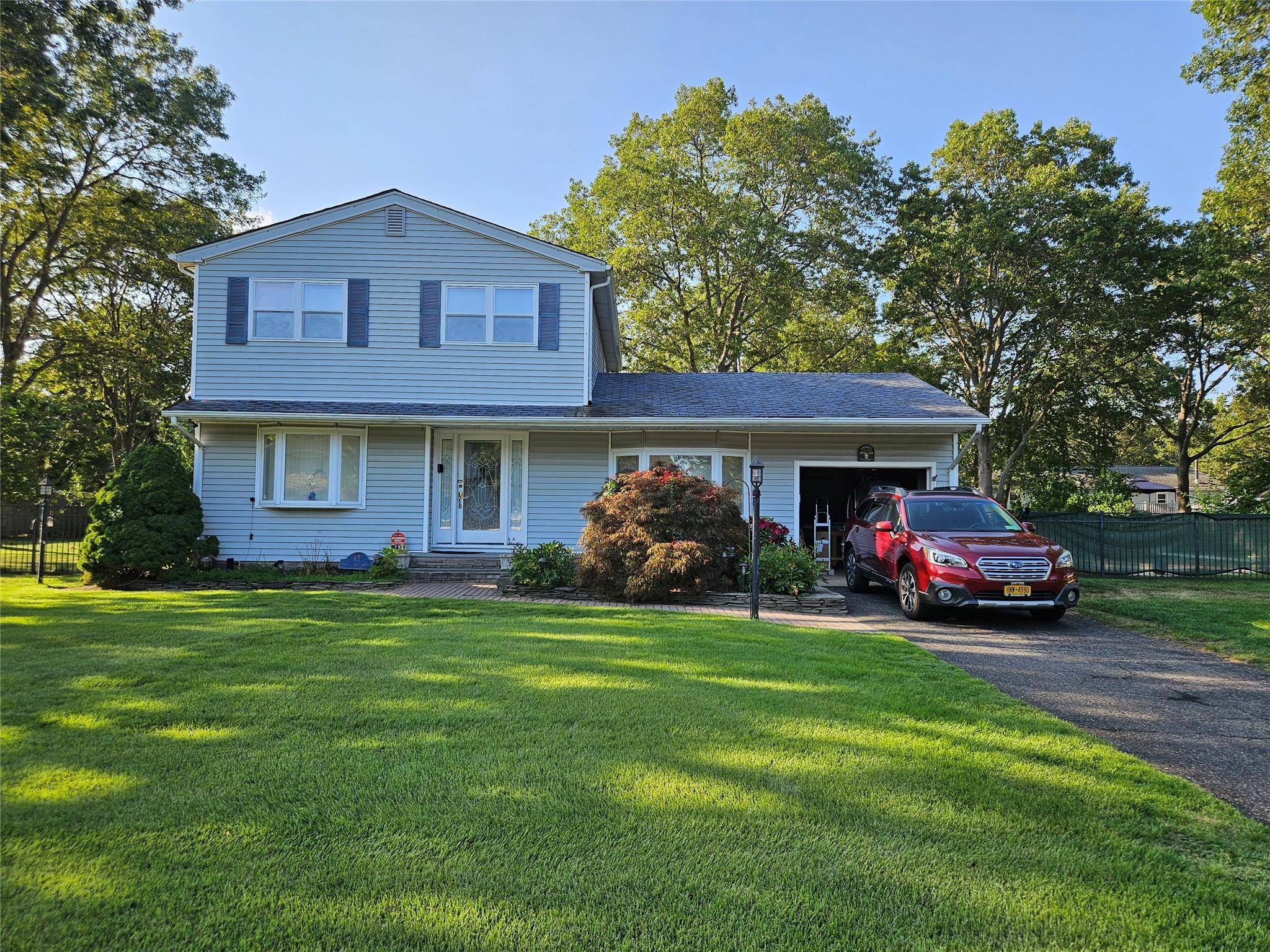 Spacious 4 bedroom, 1. 5 bath colonial in Sachem school district.