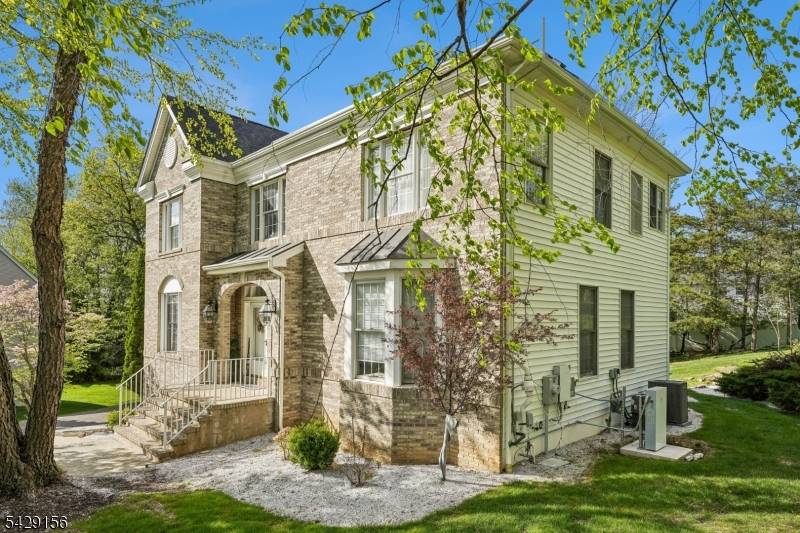 Welcome to this stunning brick front Colonial, perfectly positioned on a private cul de sac in one of Wayne's most sought after locations.