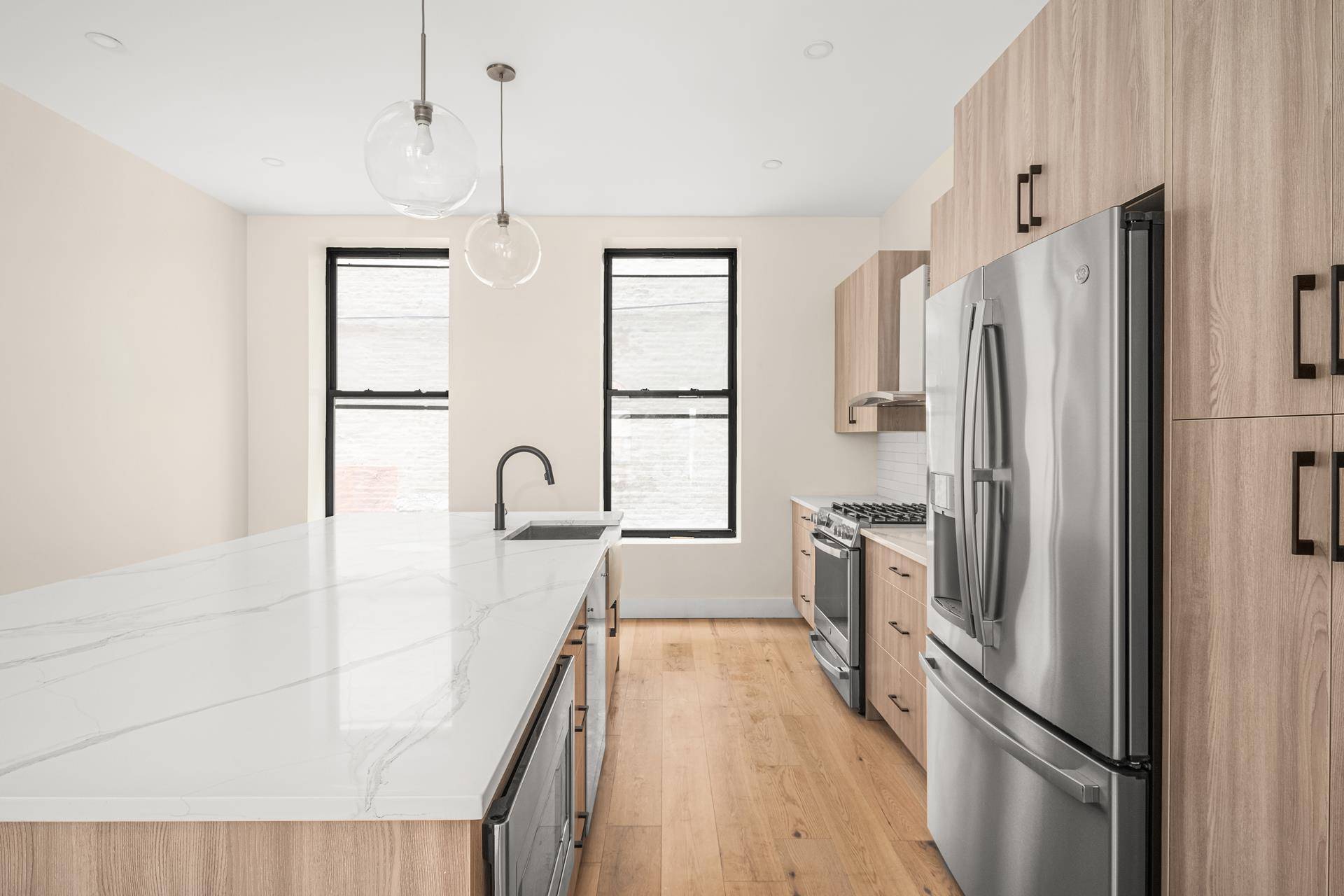 This 18 foot wide, three bedroom, three and a half bathroom single family home spanning a 2728 sf interior features the charming facade of a traditional South Harlem brownstone.