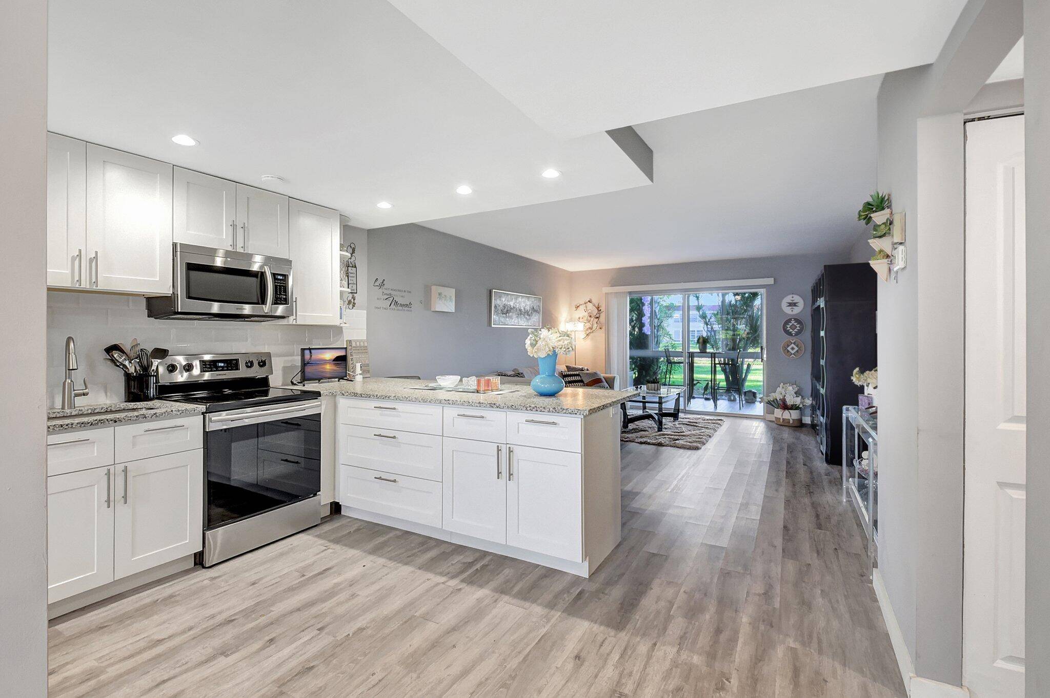 Move right in to the totally renovated 3 years ago 2 Bedroom 2 Bath Lake View Condo with newly installed HURRICANE WINDOWS AND DOORS !