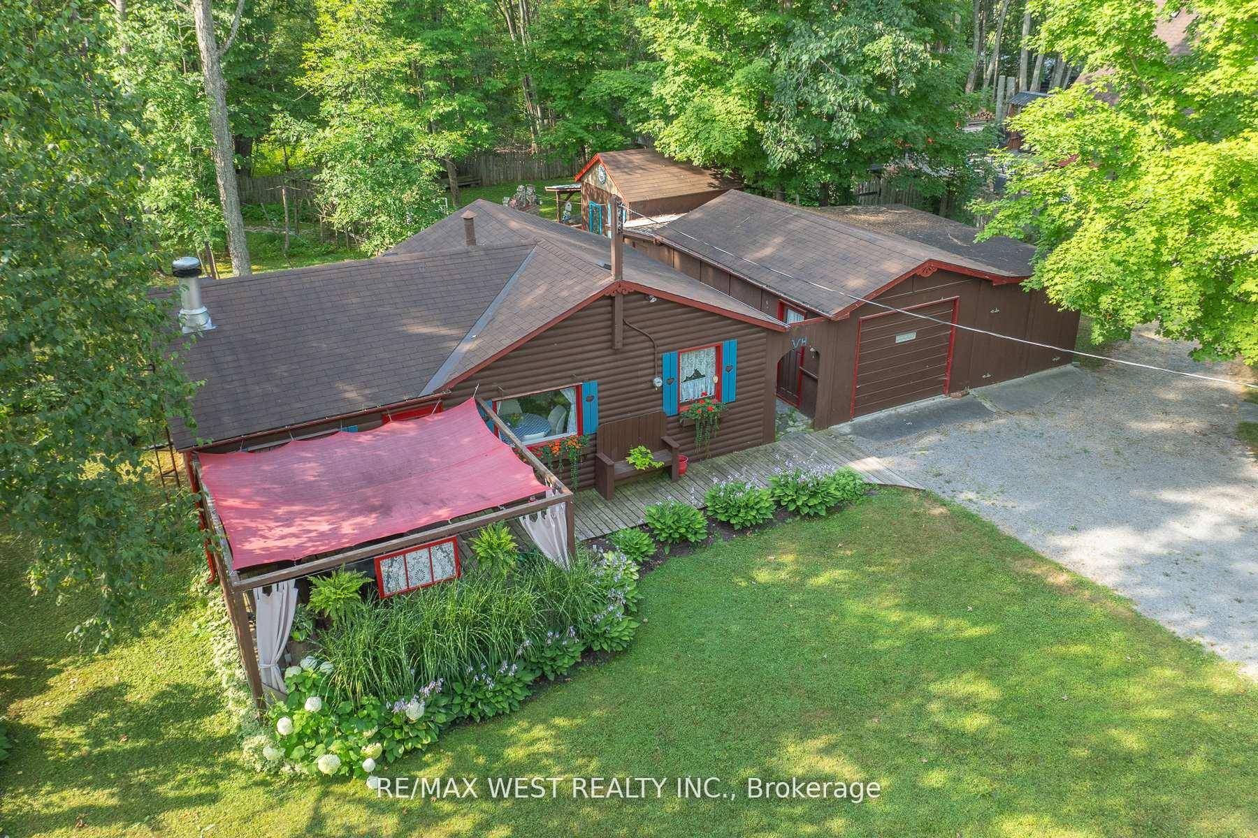 Belmont Lake cottage getaway offers a tranquil retreat just under an acre of private, nature filled scenery.