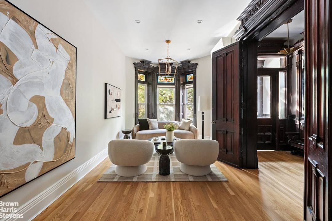 The moment this exquisite single family brownstone comes into view, its ornate facade and rich architectural detailing immediately capture the eye.
