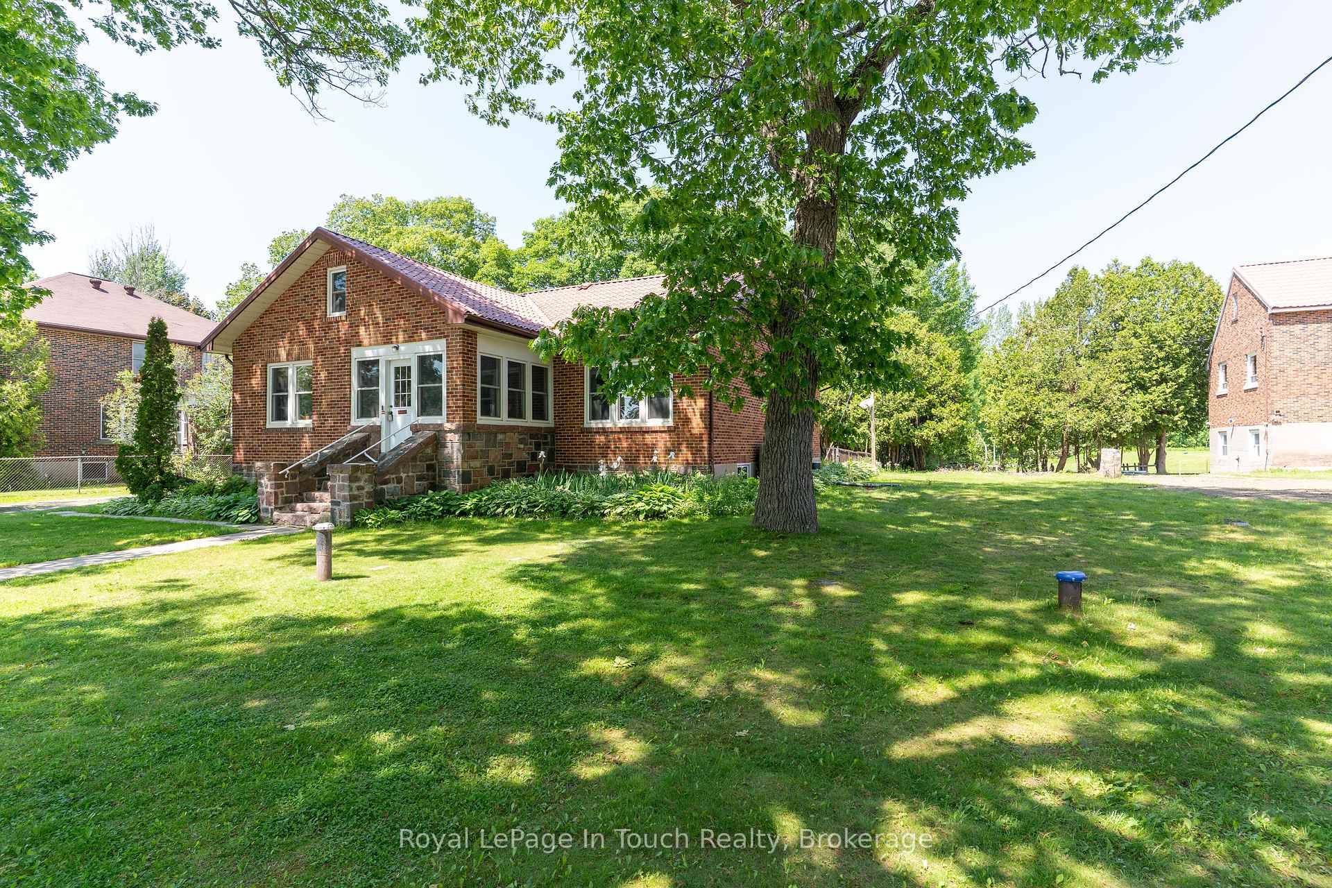This all brick bungalow is located in the small town of Honey Harbour right near the shores of Georgian Bay.
