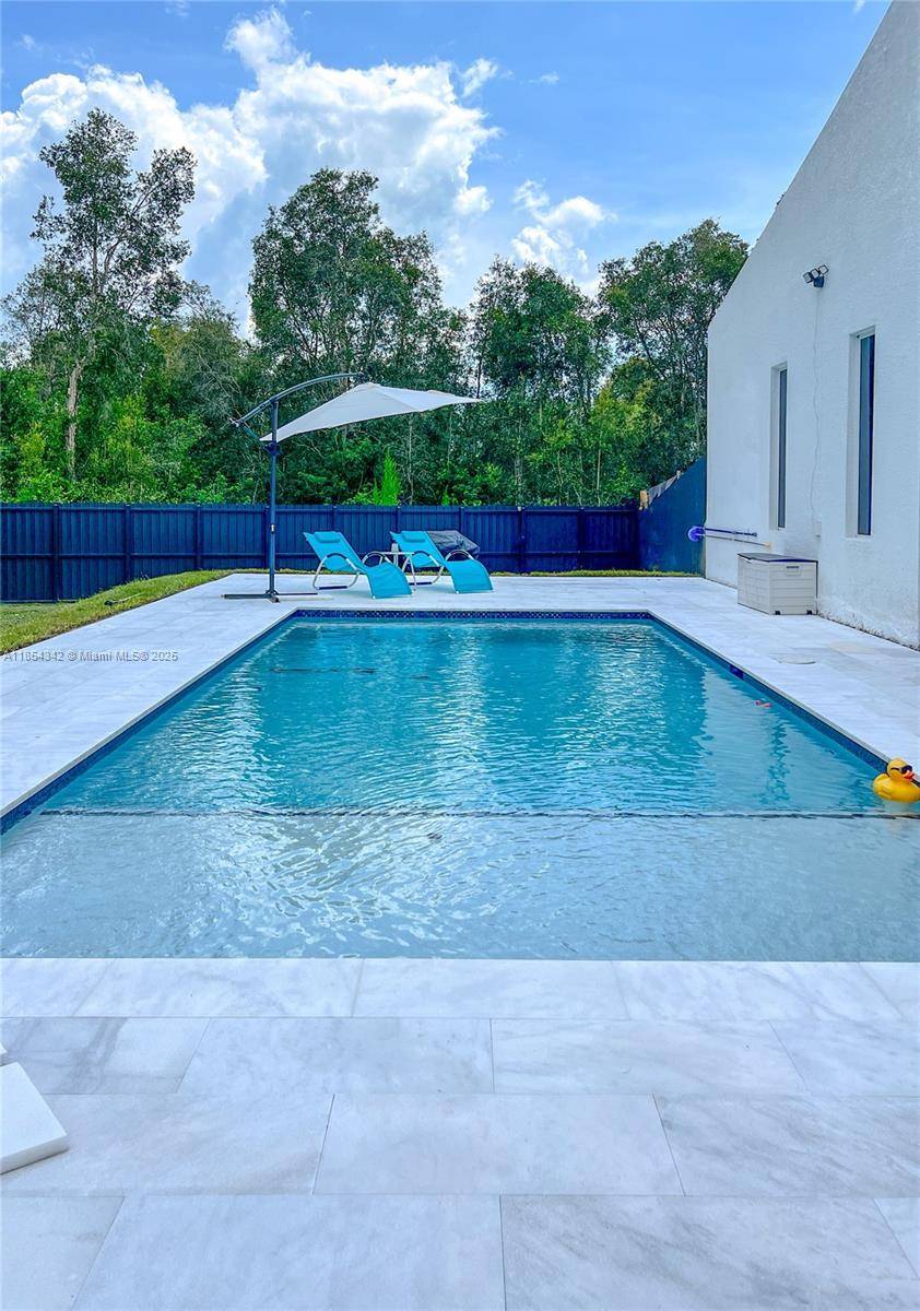 Architecturally distinctive modern home with soaring 18 ft ceilings.