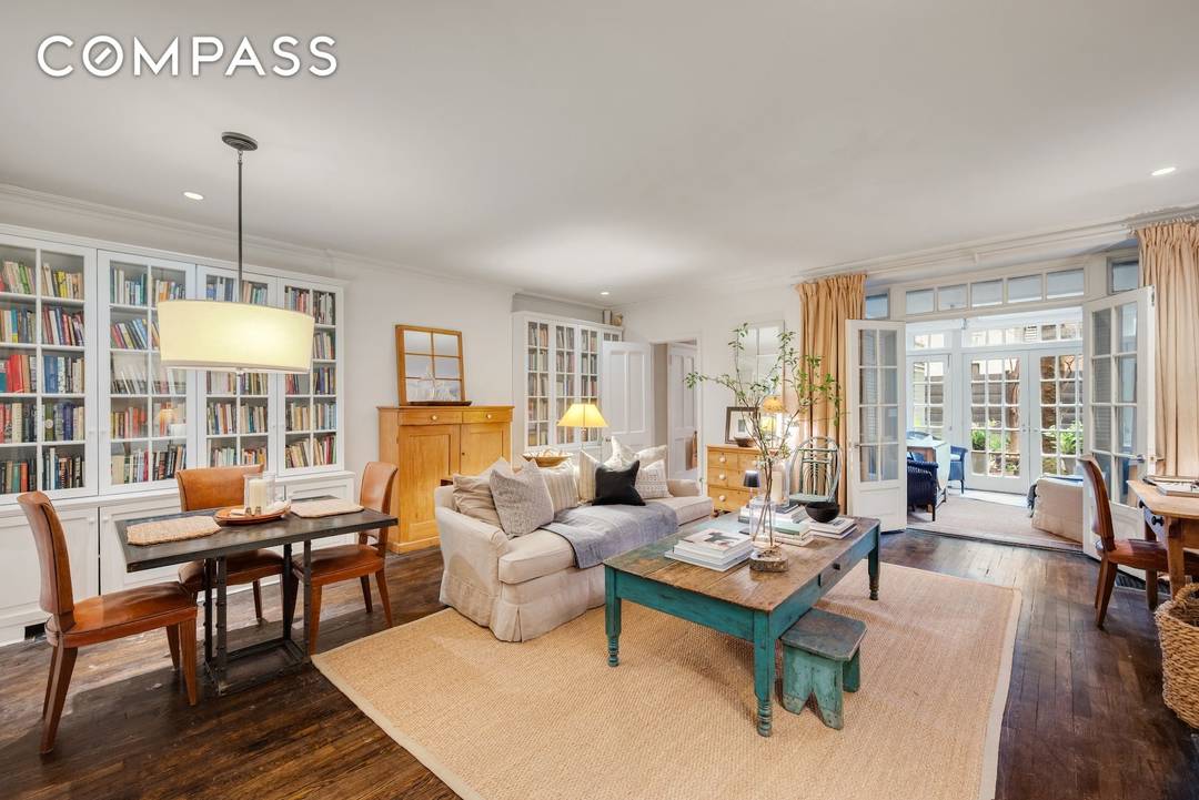 Prepare to fall in love with this charming two bedroom in an 1883 town house coop with two working wood burning fire place, a private outdoor space and a sunroom ...