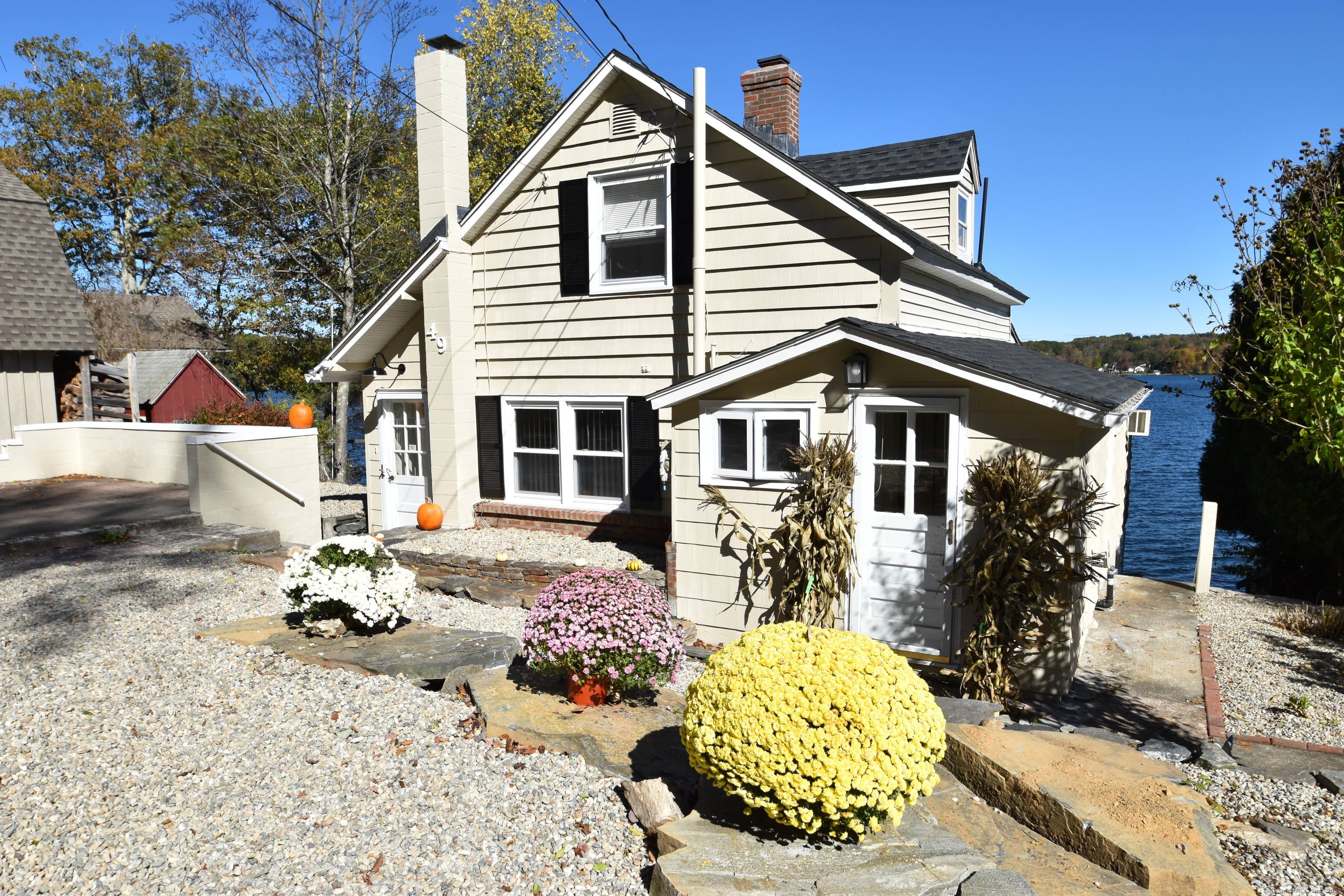 Experience the unparalleled beauty of lakefront living with this exquisite property on Bolton Lake.
