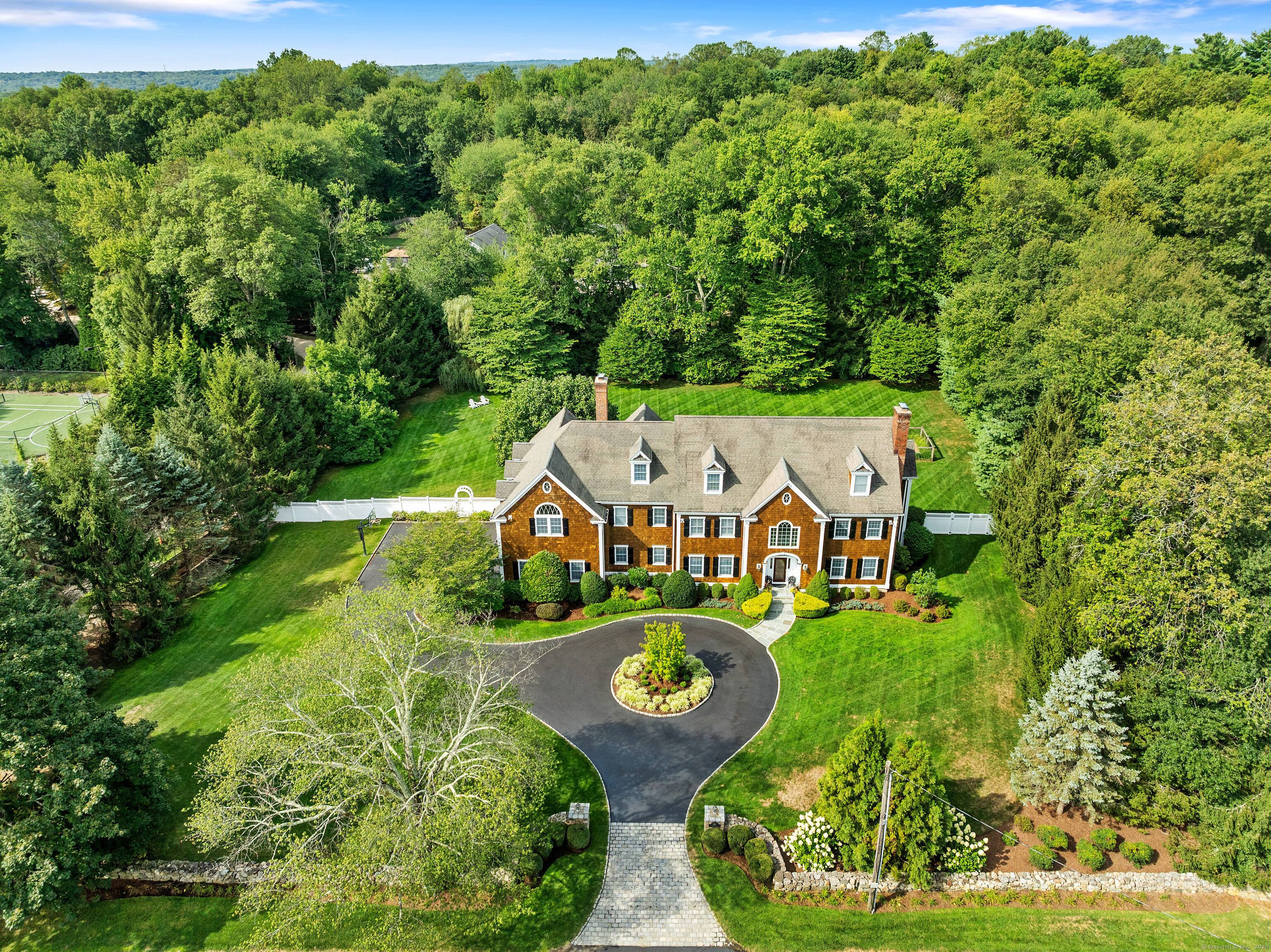 This stately 5 BR shingle style colonial with over 7000 sf in favored Sturges Ridge neighborhood is a memory making treasure !