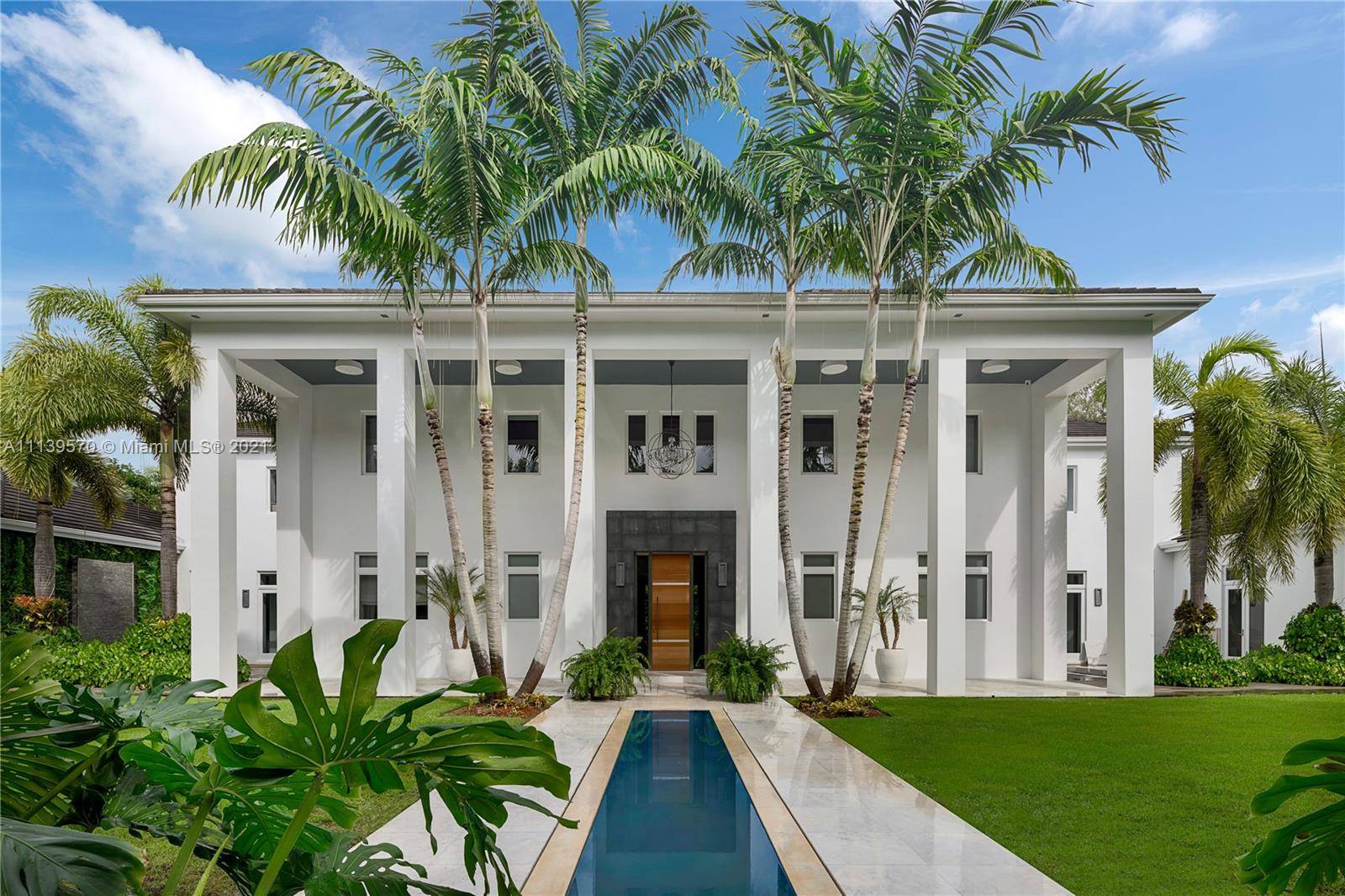 Nestled on an acre lot, this custom 2 story estate is located on a quiet cul de sac in one of Miami s most prestigious neighborhoods, Ponce Davis.