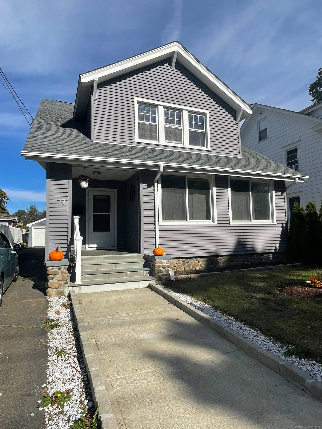 Spacious Arts Crafts home with new kitchen and 2 new full baths ; HW floors throughout ; entry foyer with Fr.