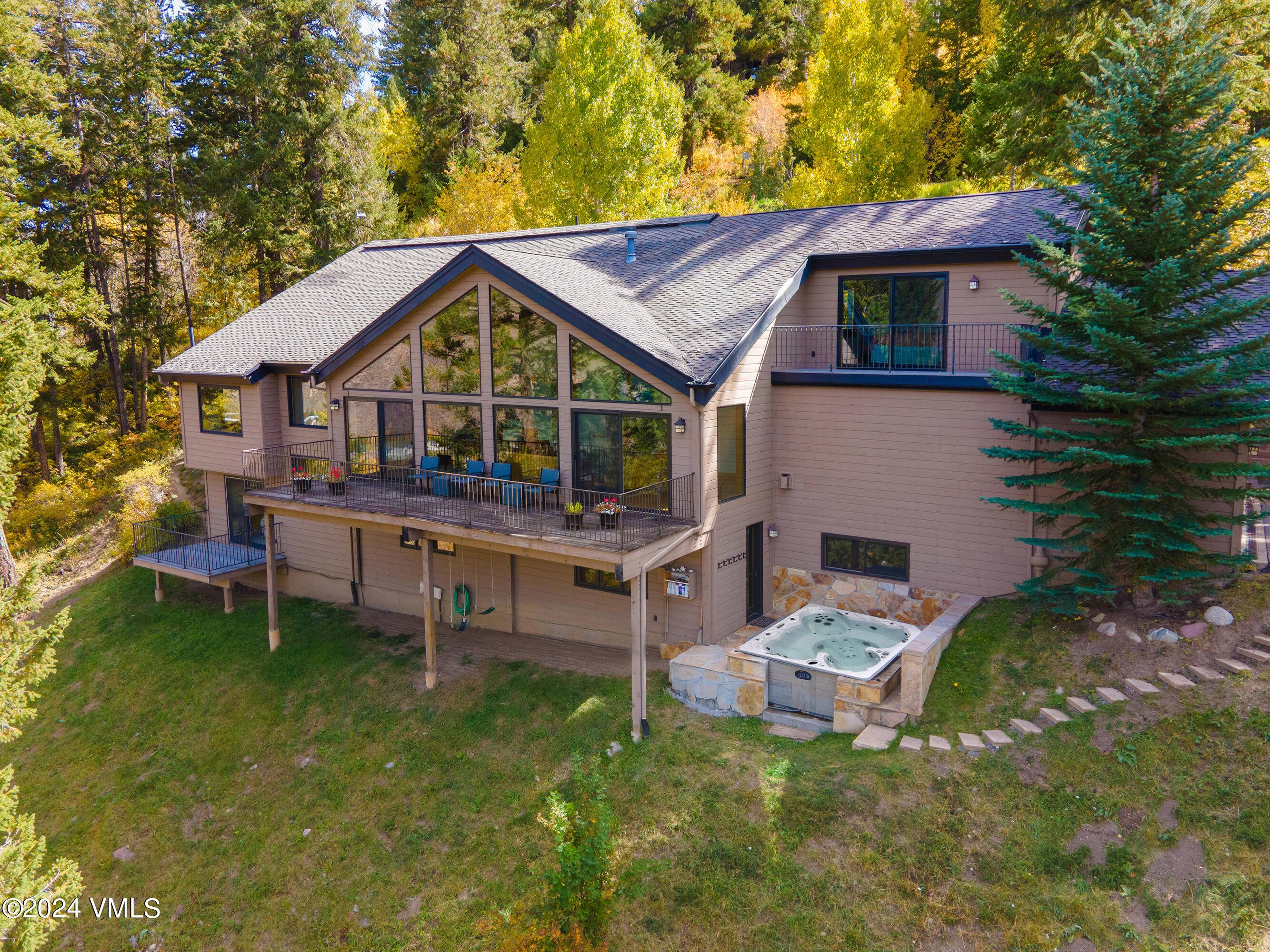 Enjoy expansive mountain valley views from this beautiful, private 6 BR 4.