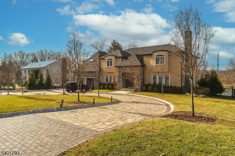 Located in the Riker Hill section of Livingston, this custom built residence offers a well designed layout with a range of interior and exterior amenities.