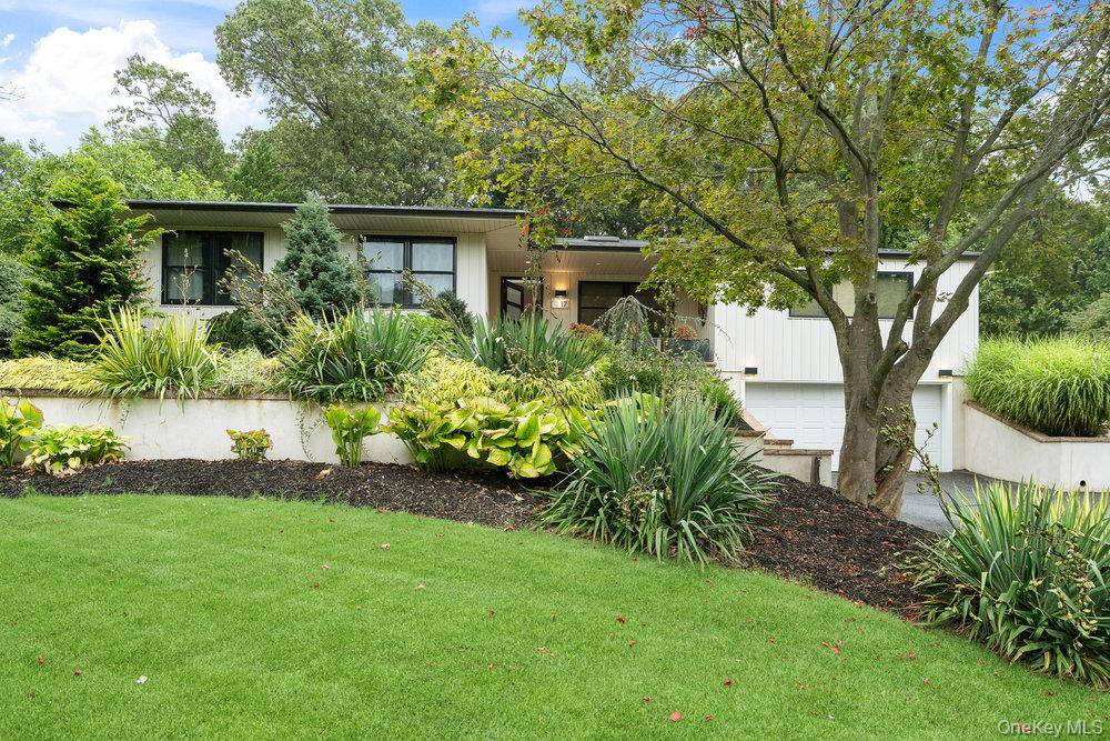 This incredible 4 bedroom, 3 bath ranch style home is situated on an expansive and private lot just off Washington Avenue.