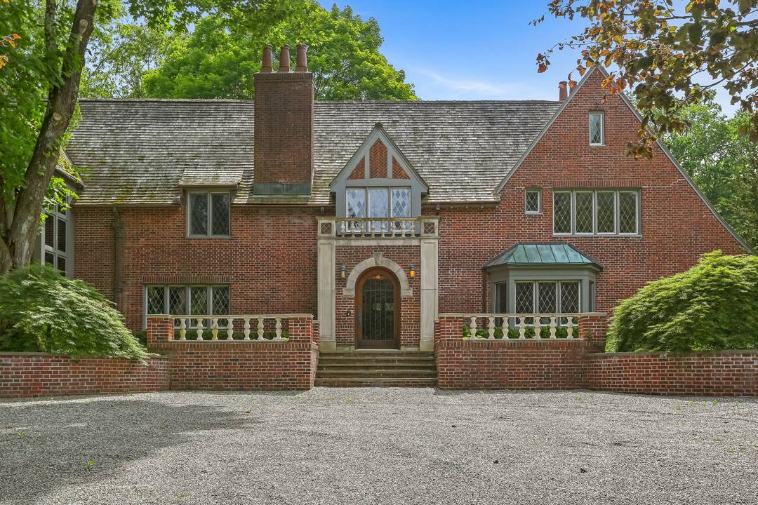 Historic charm meets modern luxury on 5 private acres in lower Weston.