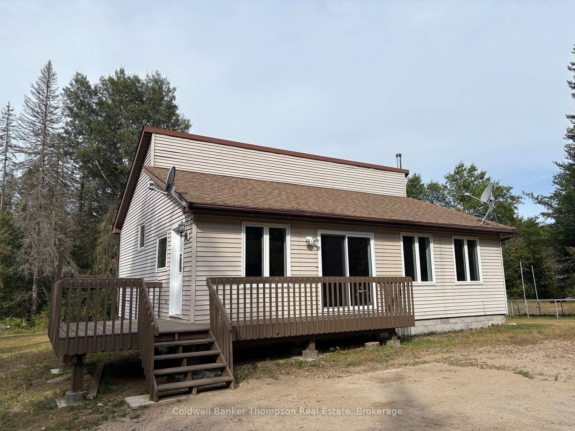 Nestled on a one acre lot, this freshly painted 3 bedroom bungalow offers the perfect blend of privacy and convenience.