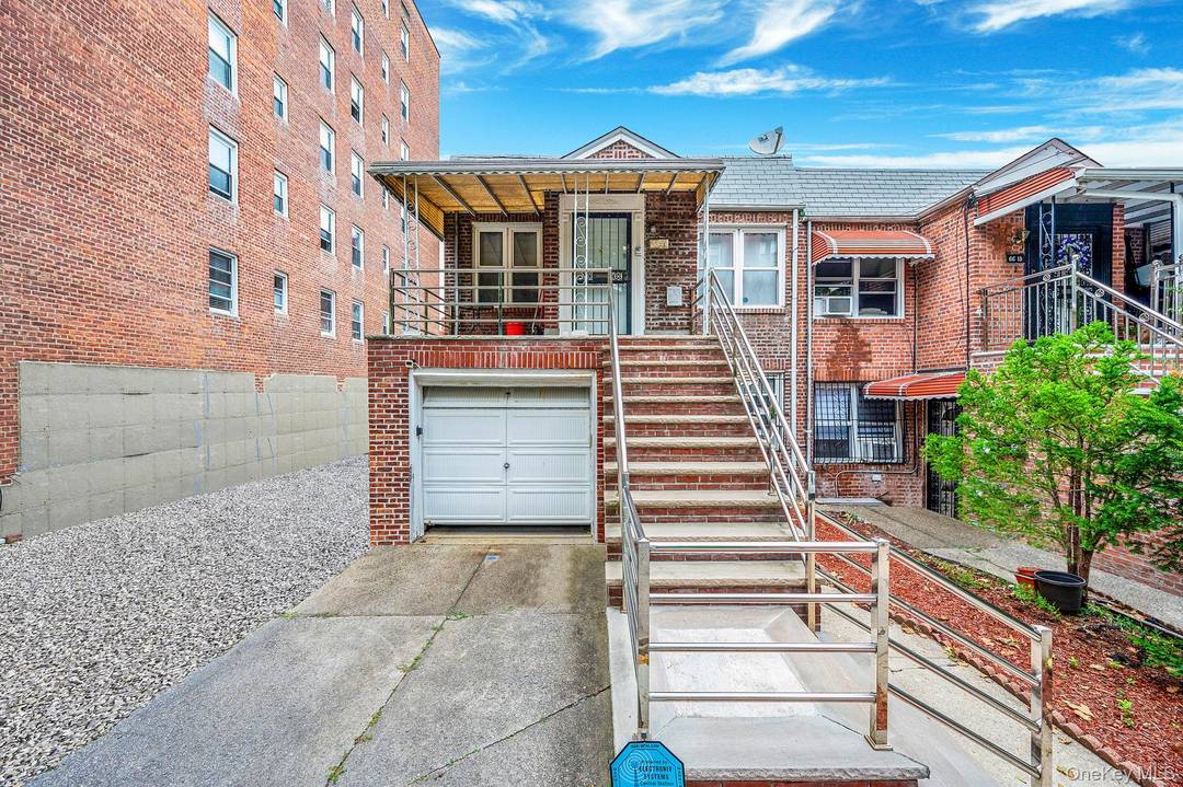 Welcome to 6611 Burns Street, a rare two family brick home in the heart of Rego Park.