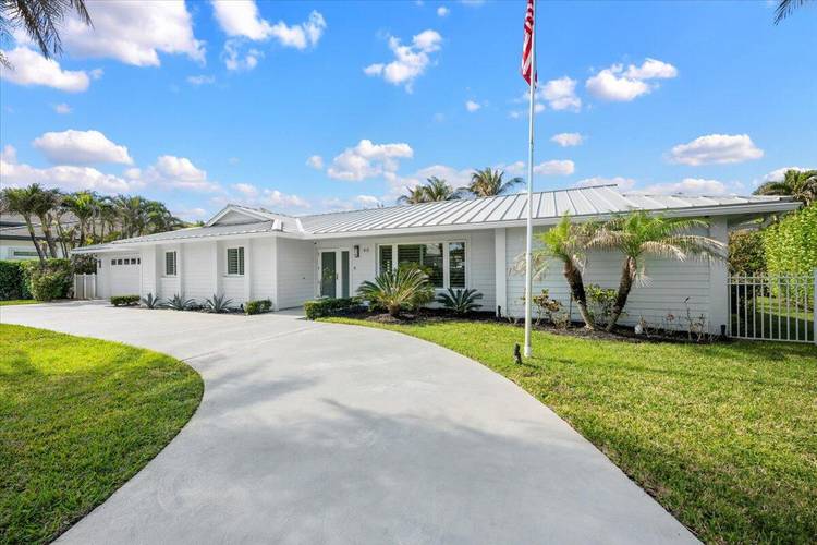 Located in the exclusive beachfront community of Jupiter Inlet Colony, this beautifully renovated 3 bedroom, 2 bath home is just steps away from the beach and Intracoastal.