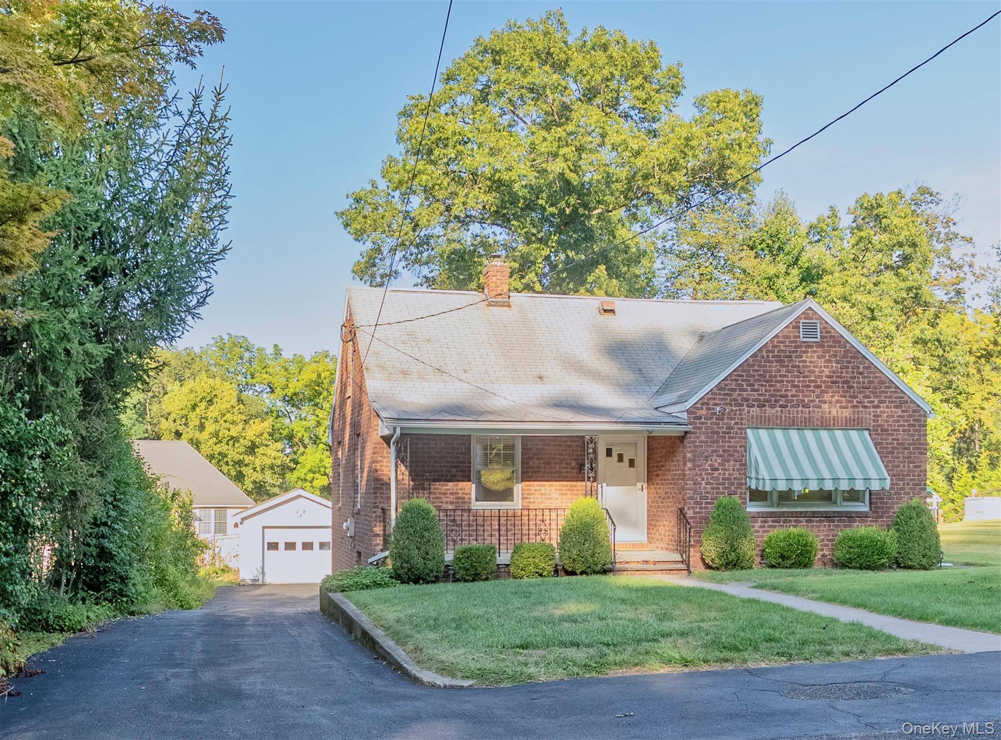 Nestled in one of Uptown Kingston's most desirable walkable neighborhoods, this classic brick Cape offers both character and convenience.