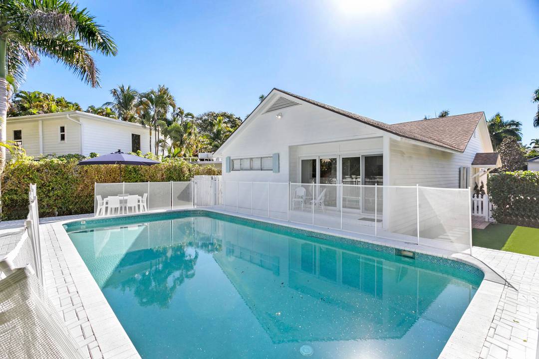 This charming 3 bedroom, 3 bath Key West style cottage has been beautifully updated and offers bright, cheerful living spaces throughout.