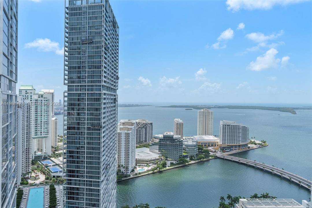 Enjoy sweeping views of the Miami River, ocean, and Brickell skyline from this bright and spacious sub penthouse.