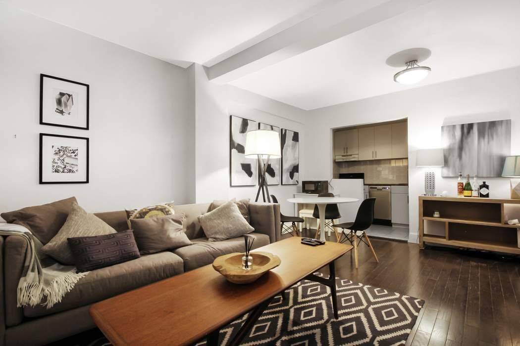 Spacious designer semi furnished 2 BR apartment features mahogany stained hardwood floors and modern and stylish furniture and decor.