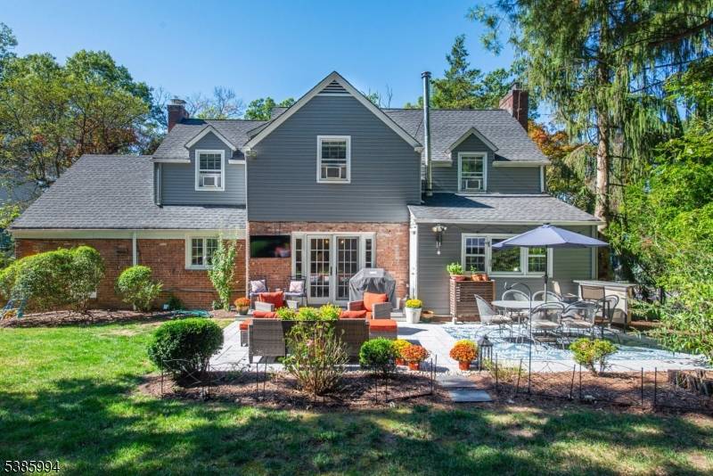 Drive down the sunny tree lined street and make a stop to see this picture perfect Colonial !