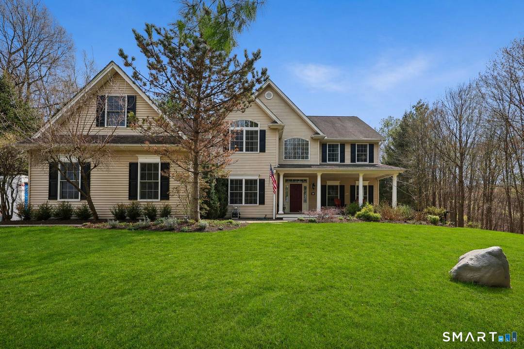 A refined blend of scale, light, and modern comfort, this exceptional Danbury residence is set on 2.