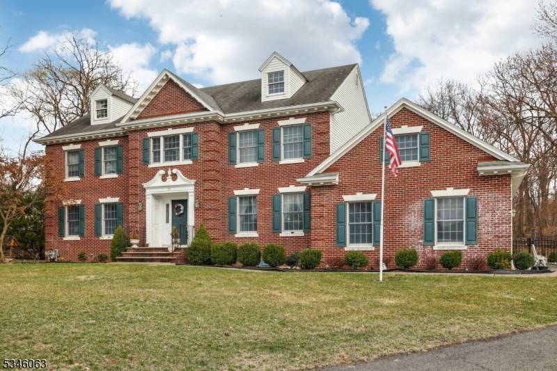 This custom built, brick front Center Hall Colonial is situated on a cul de sac and offers exceptional indoor and outdoor living.