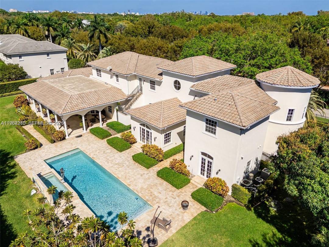 Welcome to an extraordinary modern Mediterranean estate nestled in the heart of Pinecrest, Florida, where timeless architecture and contemporary luxury converge in perfect harmony.