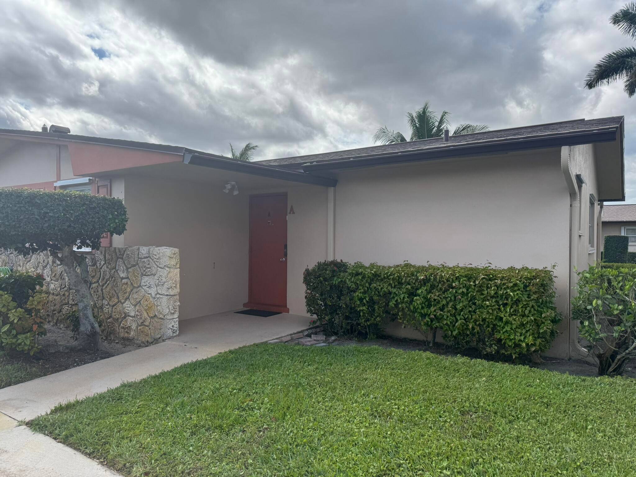 Discover effortless living in this well maintained first floor condo villa nestled in Cresthaven Villas, a quiet 55 community in West Palm Beach.