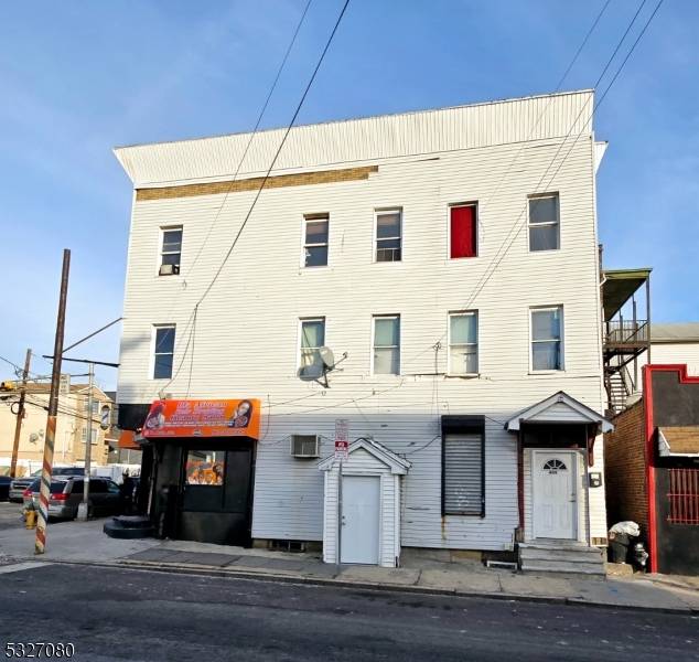 Investor's Dream ! Unique mixed use property offering two buildings for the price of one !