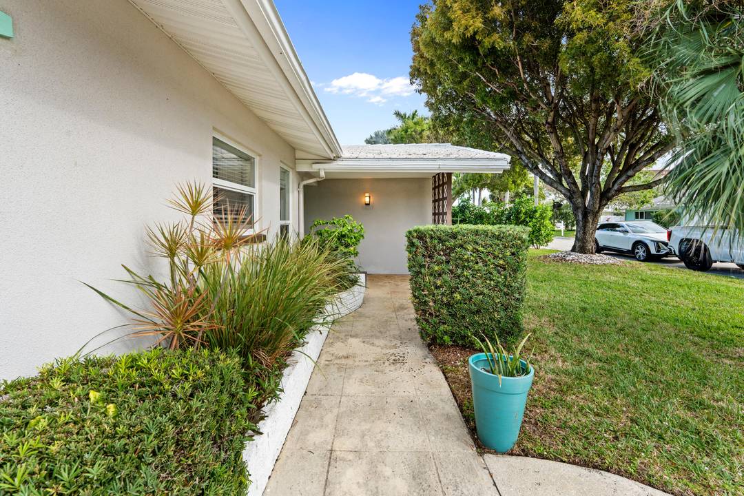Updated 3BR 2BA mid century pool home in the sought after waterfront community of Hypoluxo Shores, just steps from the Intracoastal.