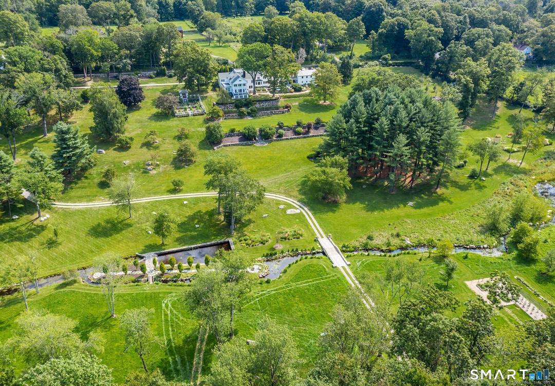 Set across 53 gated acres in Northern Fairfield County, this exceptional estate offers a remarkable combination of privacy, scale, and natural beauty, just minutes from Ridgefield, approximately 10 minutes from ...